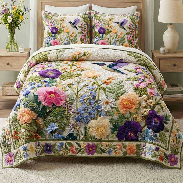 Fresh Spring quilted 3-piece bedding set on a made bed with two matching pillow shams