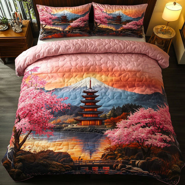 Fuji Sakura Sky quilted 3-piece bedding set on a made bed with two matching pillow shams