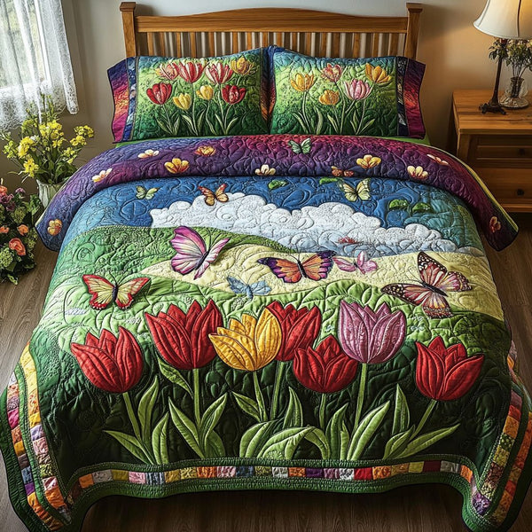 Garden Bliss quilted 3-piece bedding set on a made bed with two matching pillow shams