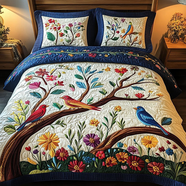 Garden Bliss quilted 3-piece bedding set on a made bed with two matching pillow shams