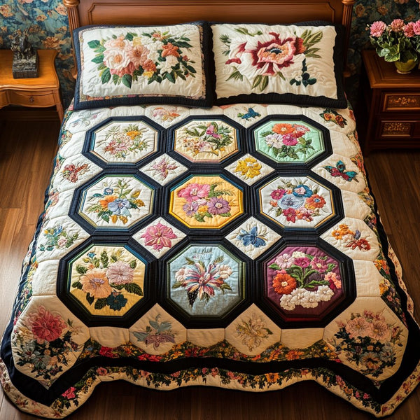 Garden Bliss quilted 3-piece bedding set on a made bed with two matching pillow shams