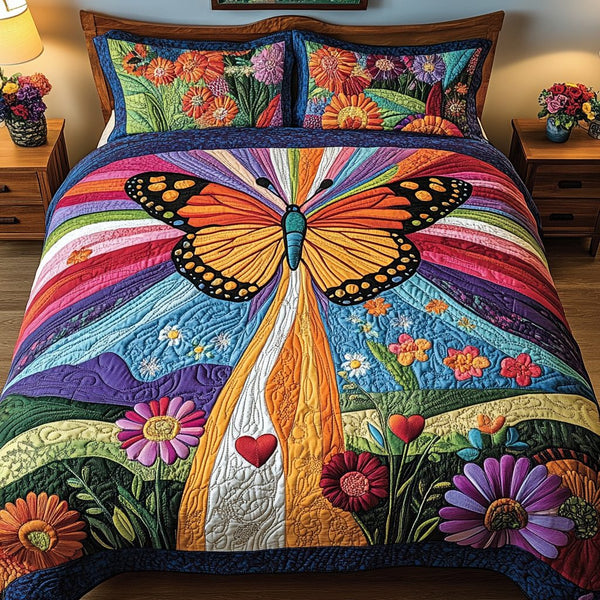 Garden Butterfly quilted 3-piece bedding set on a made bed with two matching pillow shams