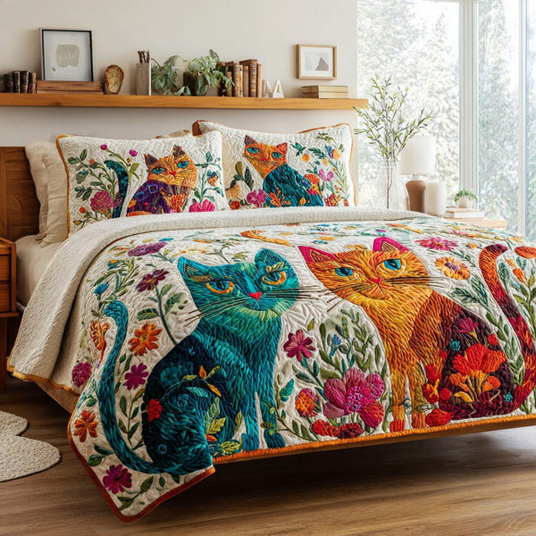Garden Cats quilted 3-piece bedding set on a made bed with two matching pillow shams