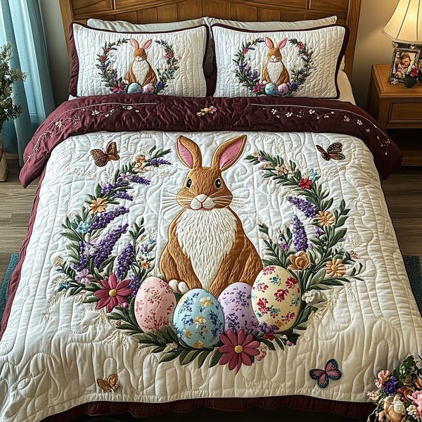 Garden Delight quilted 3-piece bedding set on a made bed with two matching pillow shams