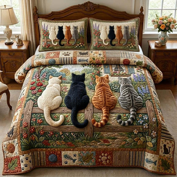 Garden Fence Cats quilted 3-piece bedding set on a made bed with two matching pillow shams