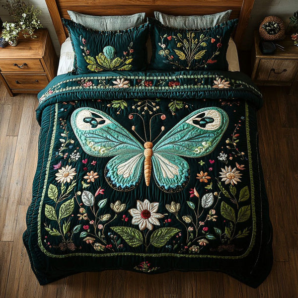 Garden Flight quilted 3-piece bedding set on a made bed with two matching pillow shams