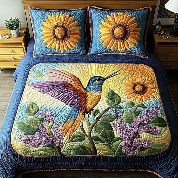 Garden Flight quilted 3-piece bedding set on a made bed with two matching pillow shams