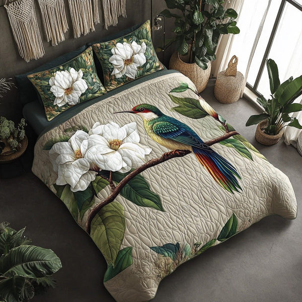 Garden Flit quilted 3-piece bedding set on a made bed with two matching pillow shams