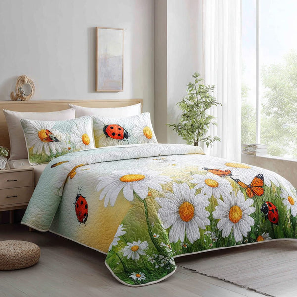 Garden Giggle quilted 3-piece bedding set on a made bed with two matching pillow shams