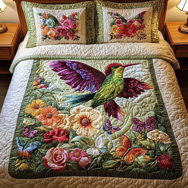 Garden Glow quilted 3-piece bedding set on a made bed with two matching pillow shams
