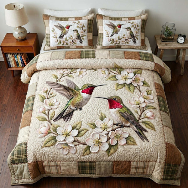 Garden Hummer quilted 3-piece bedding set on a made bed with two matching pillow shams