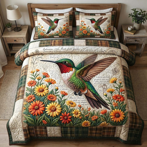 Garden Hummer quilted 3-piece bedding set on a made bed with two matching pillow shams