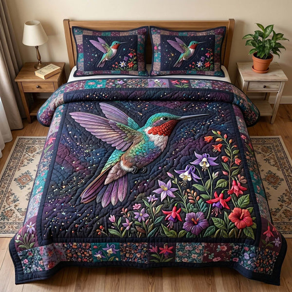 Garden Hummer quilted 3-piece bedding set on a made bed with two matching pillow shams