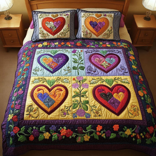 Garden Love quilted 3-piece bedding set on a made bed with two matching pillow shams