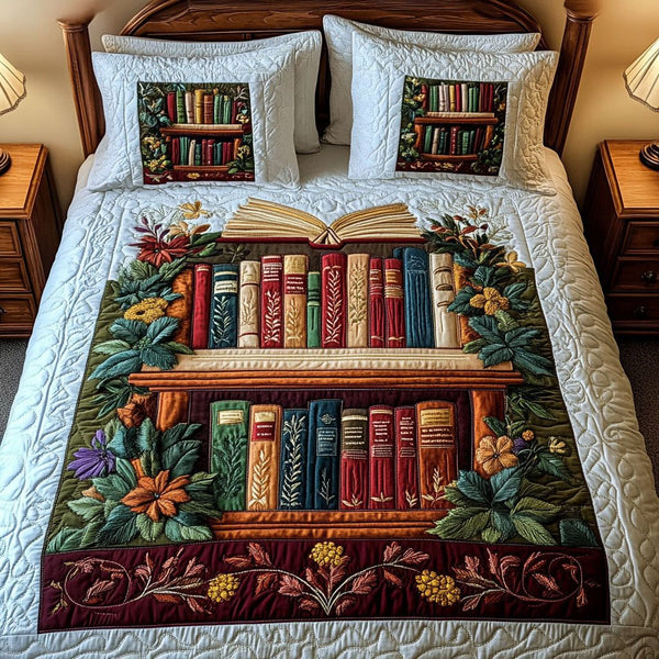 Garden of Books quilted 3-piece bedding set on a made bed with two matching pillow shams