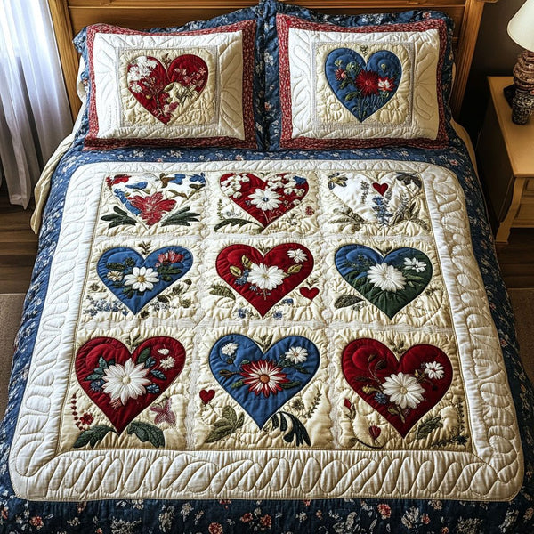 Garden of Love quilted 3-piece bedding set on a made bed with two matching pillow shams