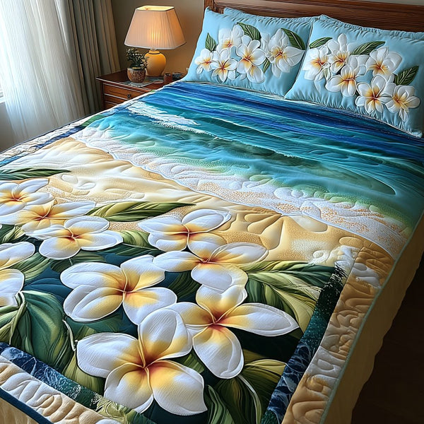 Garden of Plumeria quilted 3-piece bedding set on a made bed with two matching pillow shams