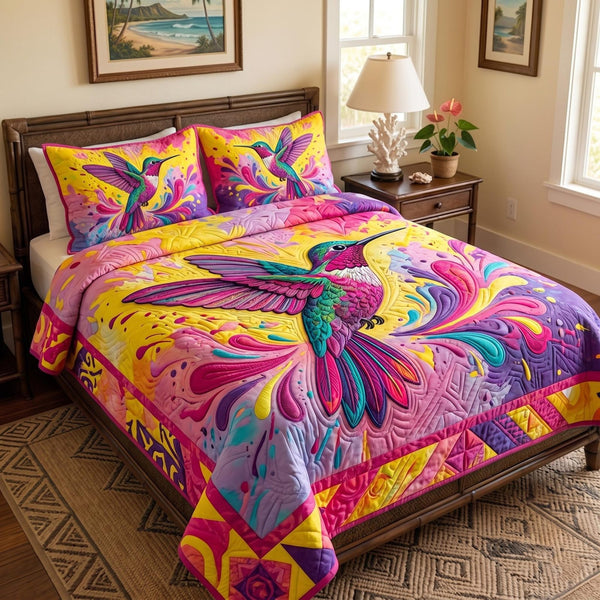 Garden of Wings quilted 3-piece bedding set on a made bed with two matching pillow shams
