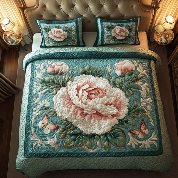 Garden Peony quilted 3-piece bedding set on a made bed with two matching pillow shams