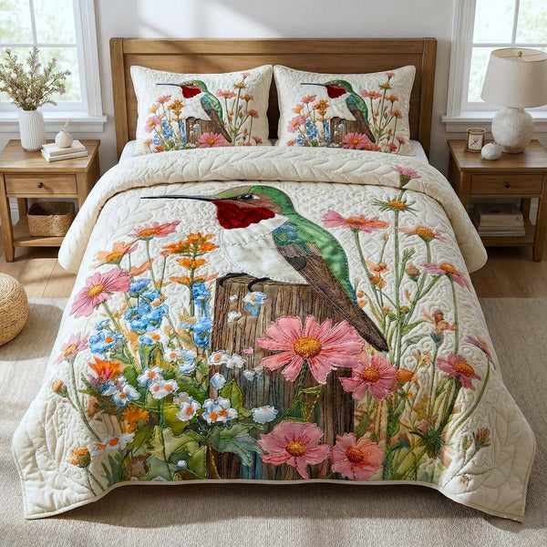 Garden Sprite quilted 3-piece bedding set on a made bed with two matching pillow shams