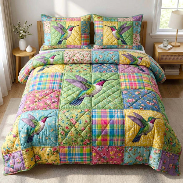 Garden Sprite quilted 3-piece bedding set on a made bed with two matching pillow shams
