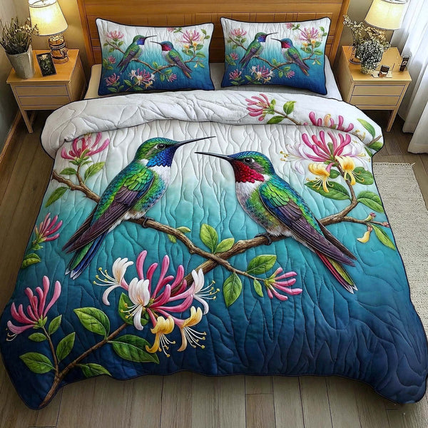 Garden Sprite quilted 3-piece bedding set on a made bed with two matching pillow shams