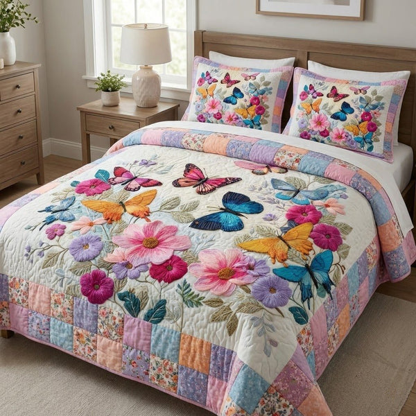 Garden Whimsy quilted 3-piece bedding set on a made bed with two matching pillow shams