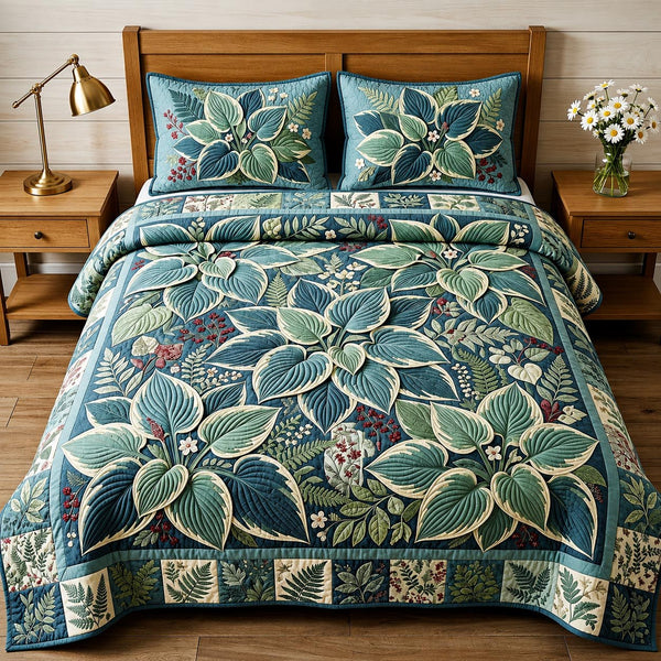 Garden Whisper quilted 3-piece bedding set on a made bed with two matching pillow shams