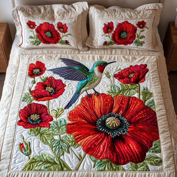Garden Wings quilted 3-piece bedding set on a made bed with two matching pillow shams