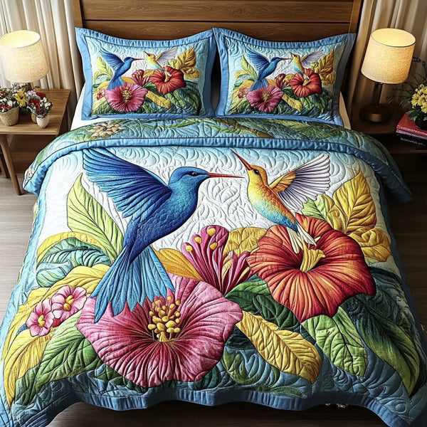 Garden Wings quilted 3-piece bedding set on a made bed with two matching pillow shams
