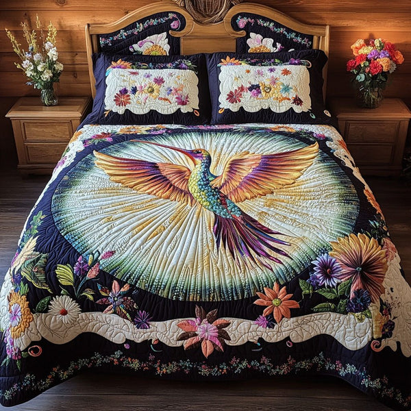 Gardens Glow quilted 3-piece bedding set on a made bed with two matching pillow shams