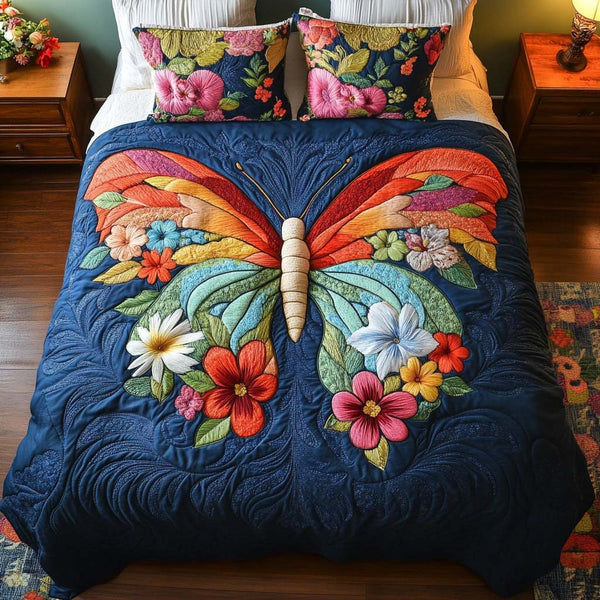 Gentle Butterfly Glow quilted 3-piece bedding set on a made bed with two matching pillow shams