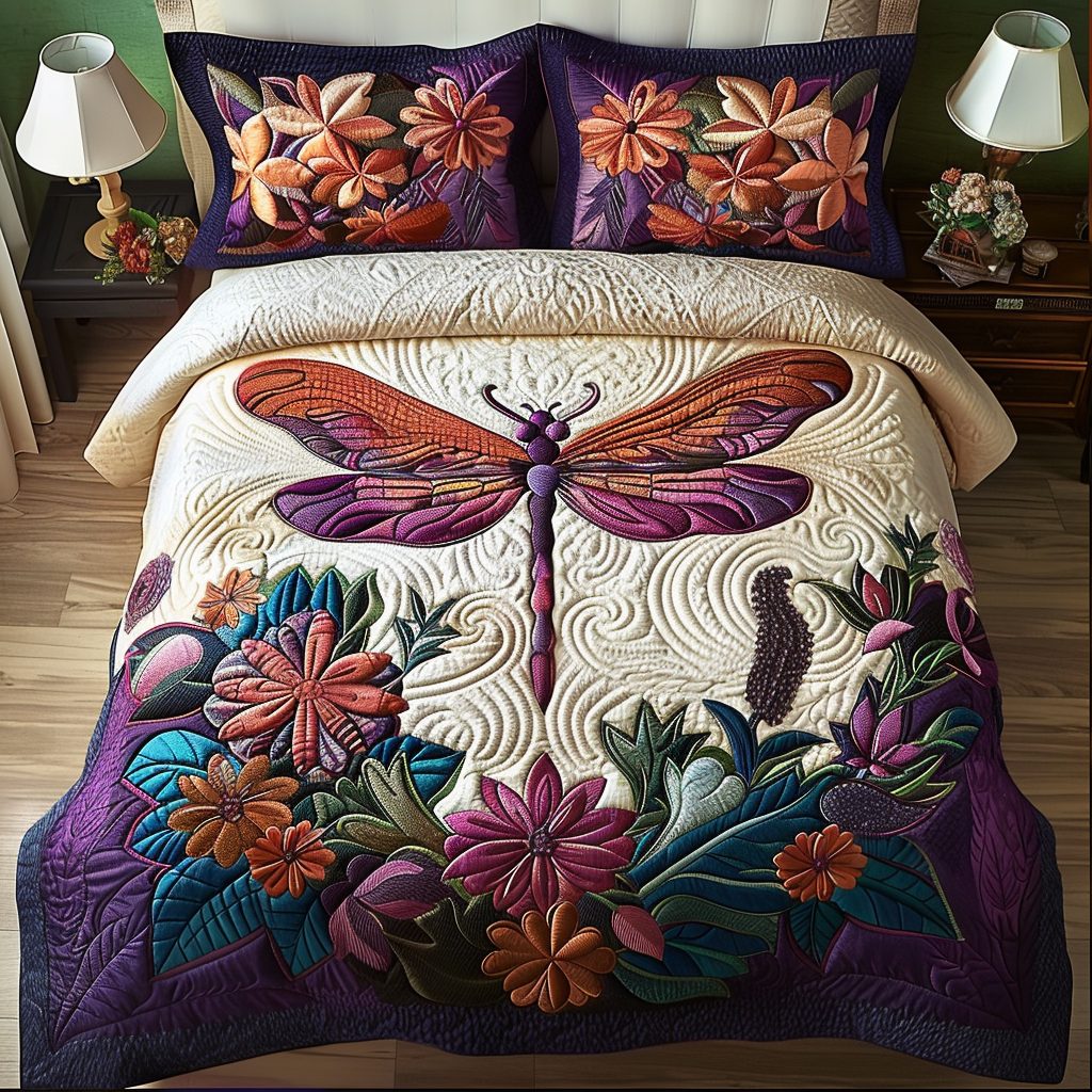 Gentle Dragonfly quilted 3-piece bedding set on a made bed with two matching pillow shams
