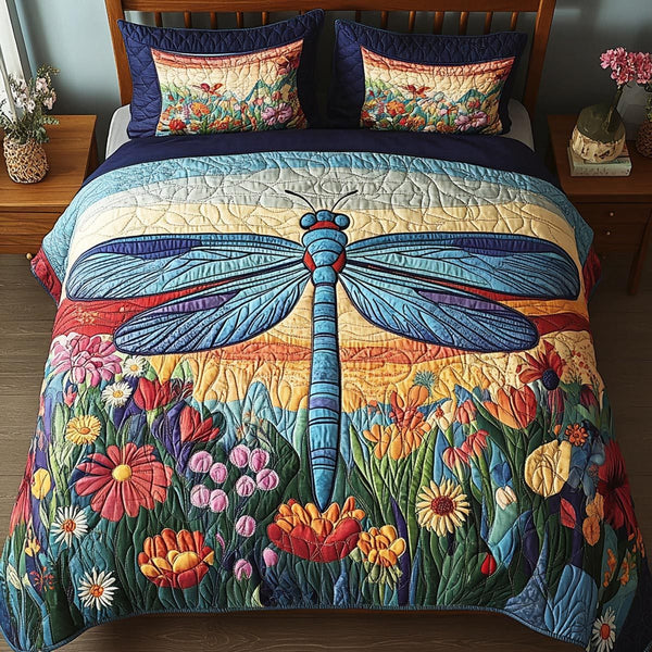 Gentle Dragonfly quilted 3-piece bedding set on a made bed with two matching pillow shams
