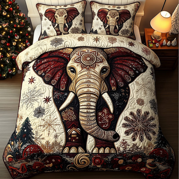Gentle Elephant quilted 3-piece bedding set on a made bed with two matching pillow shams