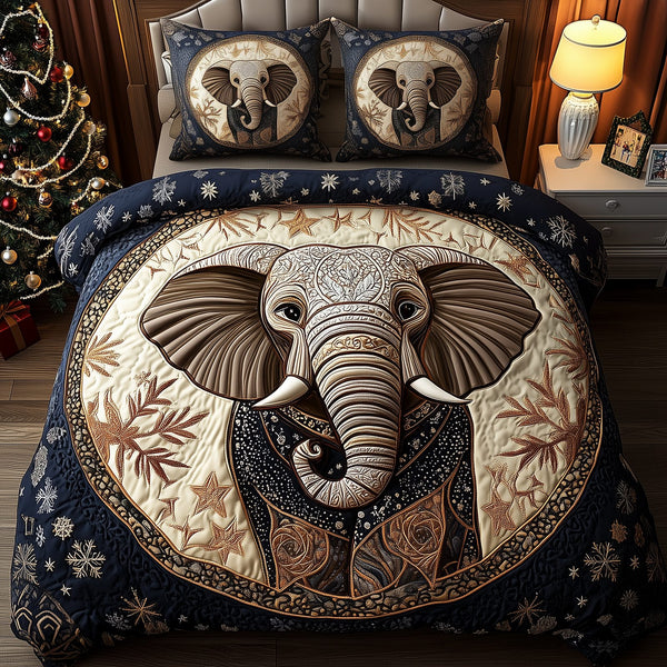 Gentle Elephant quilted 3-piece bedding set on a made bed with two matching pillow shams