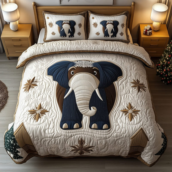 Gentle Elephant quilted 3-piece bedding set on a made bed with two matching pillow shams