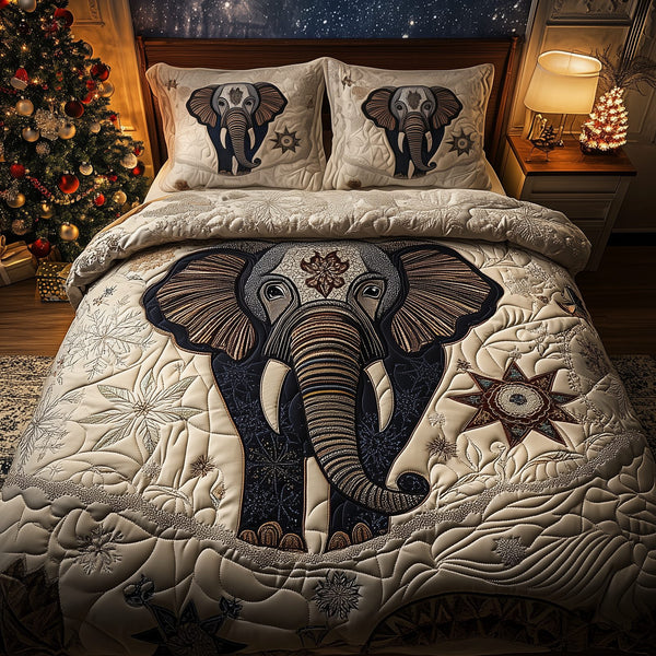 Gentle Elephant quilted 3-piece bedding set on a made bed with two matching pillow shams