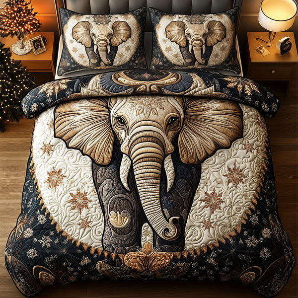 Gentle Elephant quilted 3-piece bedding set on a made bed with two matching pillow shams