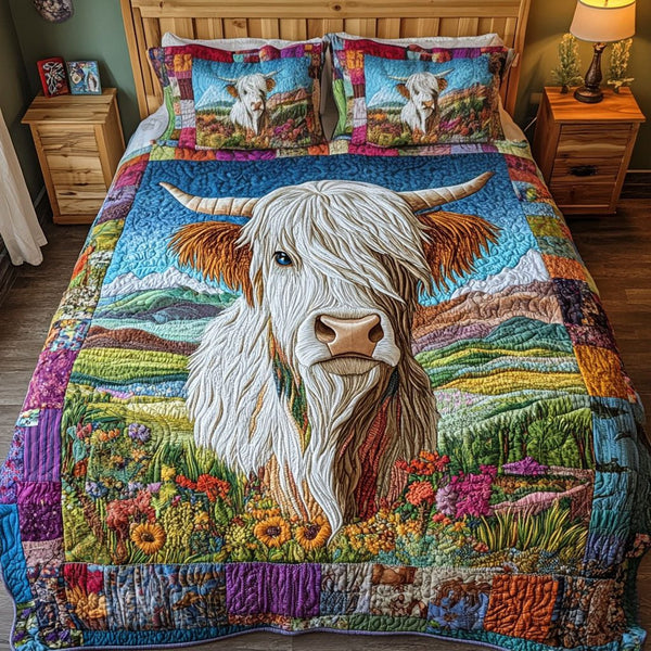 Gentle Grazer quilted 3-piece bedding set on a made bed with two matching pillow shams