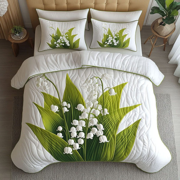 Gentle Lilies quilted 3-piece bedding set on a made bed with two matching pillow shams