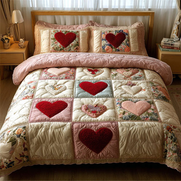 Gentle Love quilted 3-piece bedding set on a made bed with two matching pillow shams