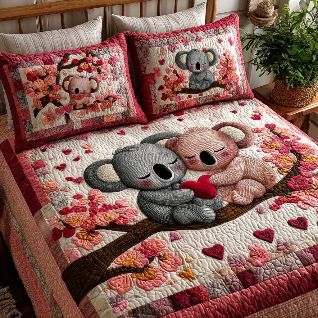 Gentle Pair quilted 3-piece bedding set on a made bed with two matching pillow shams