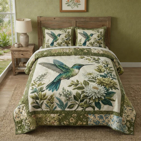 Gentle Wings quilted 3-piece bedding set on a made bed with two matching pillow shams