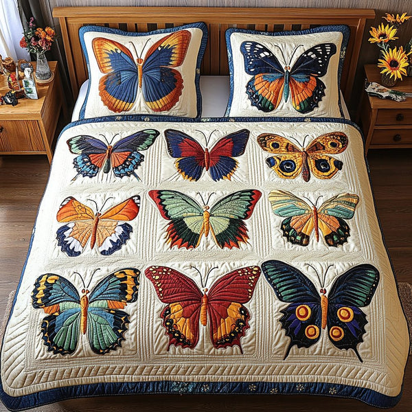 Gentle Wings quilted 3-piece bedding set on a made bed with two matching pillow shams