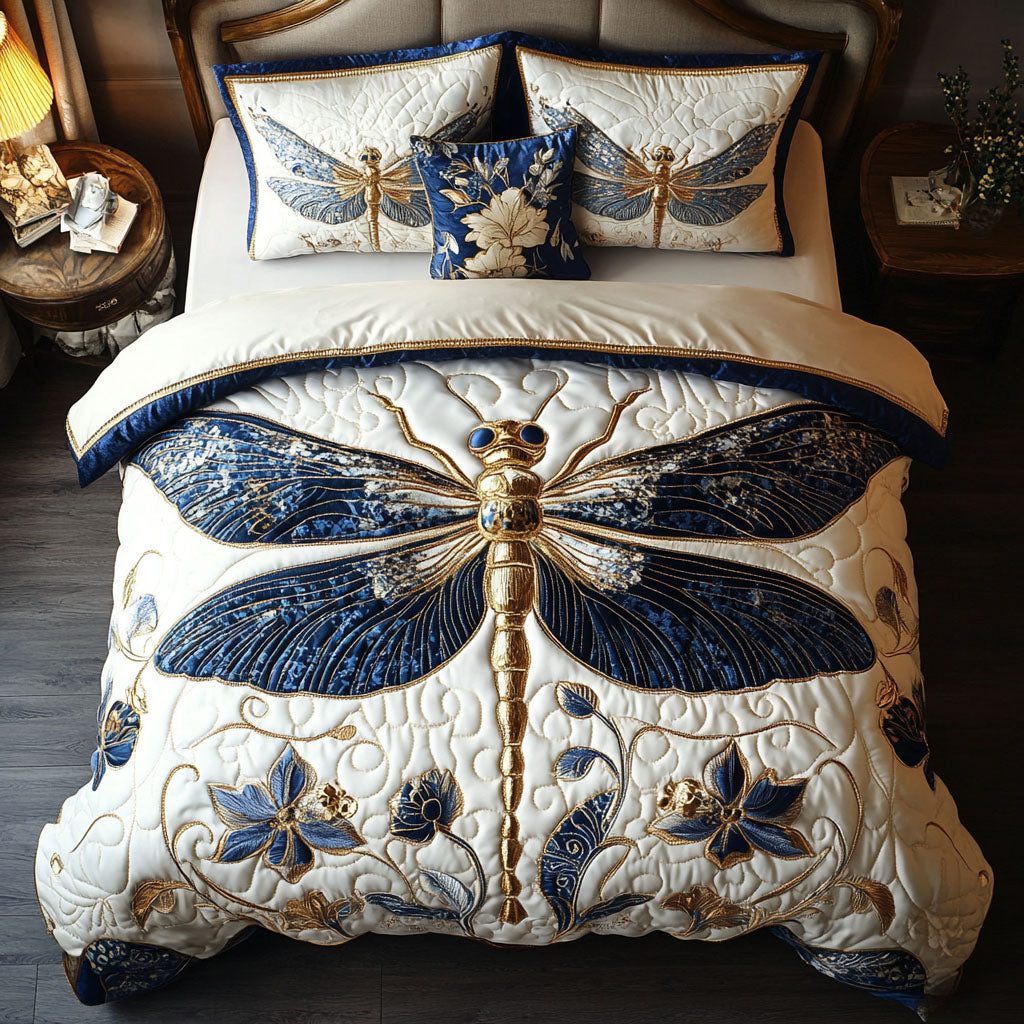 Gilded Flight quilted 3-piece bedding set on a made bed with two matching pillow shams