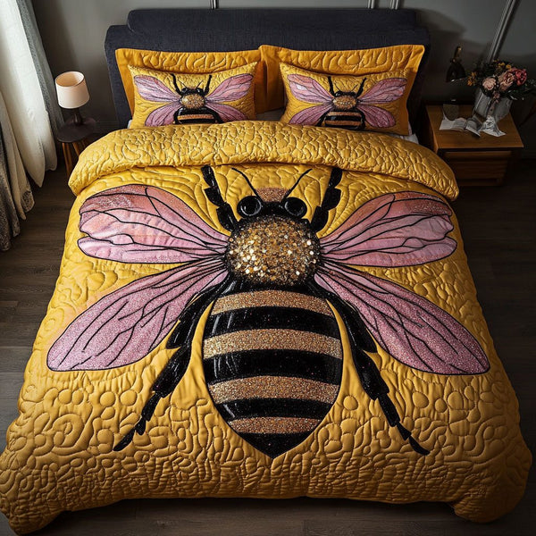 Glitter Bee Charm quilted 3-piece bedding set on a made bed with two matching pillow shams