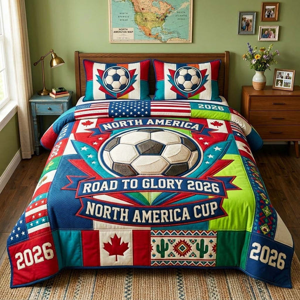 Glory Ball quilted 3-piece bedding set on a made bed with two matching pillow shams