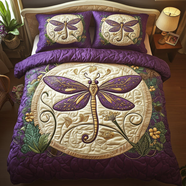 Glowing Dragonfly quilted 3-piece bedding set on a made bed with two matching pillow shams