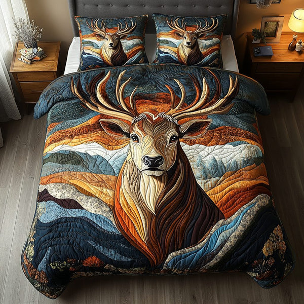 Golden Antlers quilted 3-piece bedding set on a made bed with two matching pillow shams